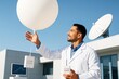© Pixels Hunter - Scientist launching ozone sonde balloon for atmospheric research near satellite dish on a clear day, symbolizing science and data collection concept. Ai generative
