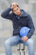 © auremar - workman with helmet with tired