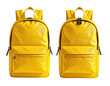 © Arya - Two identical yellow backpacks with black zippers, isolated on a black background