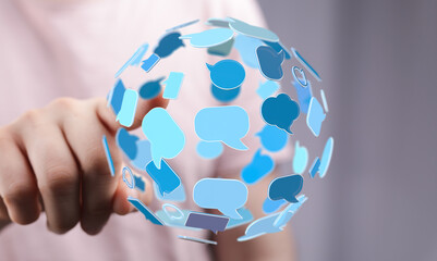 Closeup of global communication network sphere and a hand, symbol of worldwide connections. Focus on business, marketing, and digital outreach.