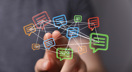 Abstract representation of communication. Hand pointing towards glowing message bubbles, symbolizing digital connectivity, social media, and the