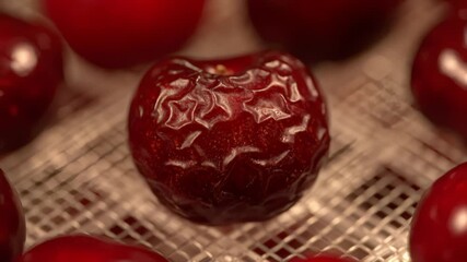 Macro Shot of Textured Deep Red Cherry on White Mesh