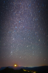 Wall Mural - In the clear dawn before sunrise, the autumn constellations rise with shooting star. (cassiopeia, andromeda, perseus and milky way)