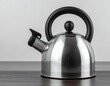 © sabrang - Elegant Silver Kettle on Dark Wood Surface A Study in Home Kitchen Simplicity