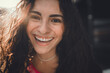 © BullRun - Extreme close-up of joyful woman with radiant smile and curly hair. Personal energy, unfiltered beauty, and emotional authenticity shine in modern digital-era portrait.