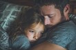 © Serhii - Tender Moment: Portrait of Father Consoling Sad Daughter Embraced on Bed at Home