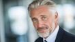 © Serhii - Portrait of a Confident Elder Executive: A Photogenic Mature Businessman Embracing Success and Happiness in Corporate Life