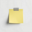 © MOJIBUR - Describes a yellow sticky note paper with gray tape at the top, featuring a soft shadow against a white background in a minimal and clean design with a realistic style