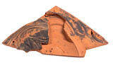 Ancient ceramic fragment with dark patterns. Broken pottery