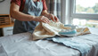 © Ol - Housekeeper ironing white linen in bright room, domestic service concept.