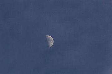 Wall Mural - Moon in the blue sky with white clouds, 