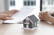 © Arman - Businessman analyzing real estate investment data