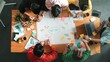 © InfiniteFlow - Group of business people writing sticky note and making mind map to brainstorming marketing idea at meeting. Top aerial view of investors sharing plan or strategy and stick note at paper. Convocation.
