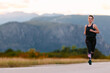 © .shock - Determined Athlete Running in the Sun amidst Beautiful Nature