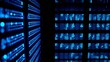 © wu - Close-up of glowing blue server rack lights creating an abstract technological pattern on a dark background.