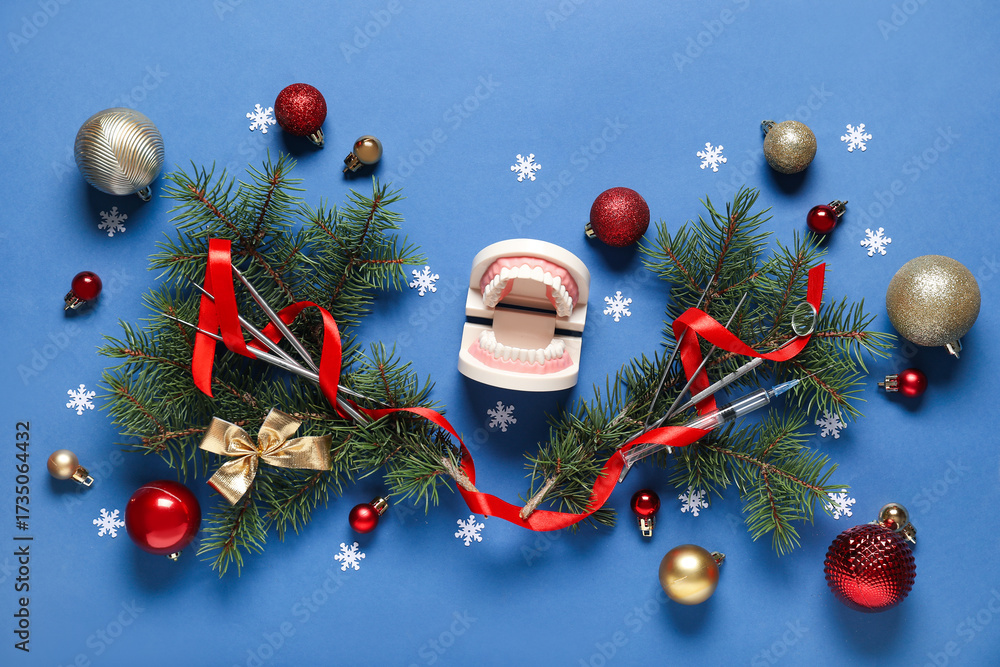 Composition with dentist's tools, fir branches and Christmas decorations on color background