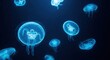 © Chainarong - High-resolution photograph of jellyfish gracefully suspended in dark blue water. The bioluminescent glow of these aquatic creatures lights up their forms