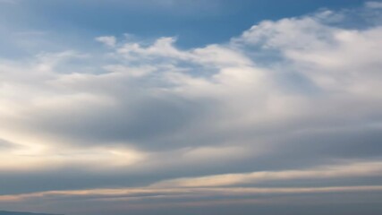Wall Mural - Gentle yet persistent swirling clouds drift across a serene sky in a peaceful, evolving atmospheric timelapse peaceful evolving atmospheric timelapse, meditation, air
