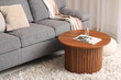 © Pixel-Shot - Stylish grey sofa with brown coffee table in living room