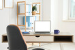 © Pixel-Shot - Workplace with modern laptop and cup of coffee on table in interior of office, closeup