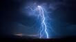 © Ahsan - Stunning lightning strike illuminating the night sky over a dark mountain landscape with distant city lights creating a dramatic and powerful natural spectacle