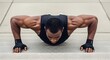 © Rumah Kantor Apart - Push-up exercise: A muscular person is doing push-ups outside, showcasing strength and commitment to physical health.