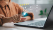 © CL STOCK - Customer satisfaction concept showing hand selecting five-star rating with smiley face on virtual screen, representing positive feedback, review, and user experience evaluation system.