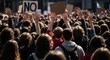 © Chainarong - A massive gathering of young people engaged in a peaceful street protest, with hands lifted high in solidarity and a sign saying no