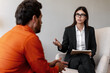© Maria Vitkovska - Counselor helping client with mental health discussion. Professional psychologist talking with man