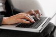 © Maria Vitkovska - Woman hands typing on laptop in office selective focus, copywriter working on keyboard