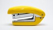 © Waqas - Glossy yellow stapler with modern design and exposed staple track placed on white background for editorial office supplies workplace tools and minimalist product-themed visuals