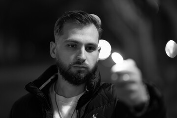 young bearded man pointing finger at viewer