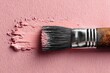 © Michael - Paintbrush creating a thick textured pink paint stroke on a matching background