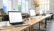 © AgungRikhi - Modern Office Workspace with Laptop Computer and Monitor Displays Wooden Desk Environment Natural Lighting