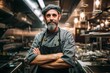 © Igor - Professional Chef with Crossed Arms in Stainless Steel Kitchen