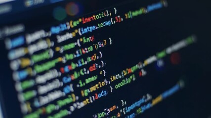 Computer Monitor Displaying Dense Colorful Programming Code Lines