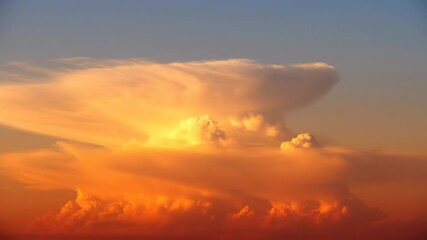 Wall Mural - ﻿Majestic golden hour clouds slowly drift across a vibrant sky with warm, radiant light colorful, time lapse, weather
