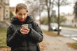 © tan4ikk - Happy Girl Talking On The Phone Against A Blurred Street Background