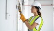 © JuanPablo - Female Electrician Installing Wiring in Modern Office, Professional Realistic HD Stock Photo