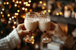 © syhin_stas - Hands of a couple holding two glasses filled with eggnog, clinking them in a toast against a bokeh background of warm Christmas lights and soft candle glow, celebrating the holiday season