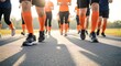 © Buddhika - Community Charity 5K Run Walk with Orange Socks, Low Angle Motion on Asphalt Path, Sun Flare