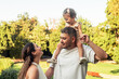 © ADDICTIVE STOCK - Family bonding in a sunny park setting