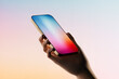 © ADDICTIVE STOCK - Hand holding a mobile phone displaying a colorful screen