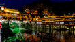 © ADDICTIVE STOCK - Phoenix Hong Bridge and boats illuminated at night