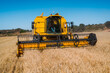 © ADDICTIVE STOCK - Yellow harvester working in a barley field in Guadalajara