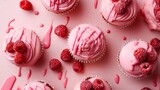 Variety of pink cupcakes decorated with raspberry toppings on a light pink background