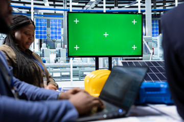 Factory manager meeting with investors, using isolated screen monitor to showcase manufacturing strategies. Man using mockup display to show shareholders report of production growth opportunities