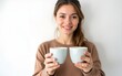 © guo - Young woman holding two cups of coffee on white background. High quality