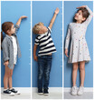 © New Africa - Cute children measuring their heights near light blue wall, collage of portraits