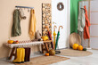 © Pixel-Shot - Interior of stylish hallway with door, bench and autumn decor
